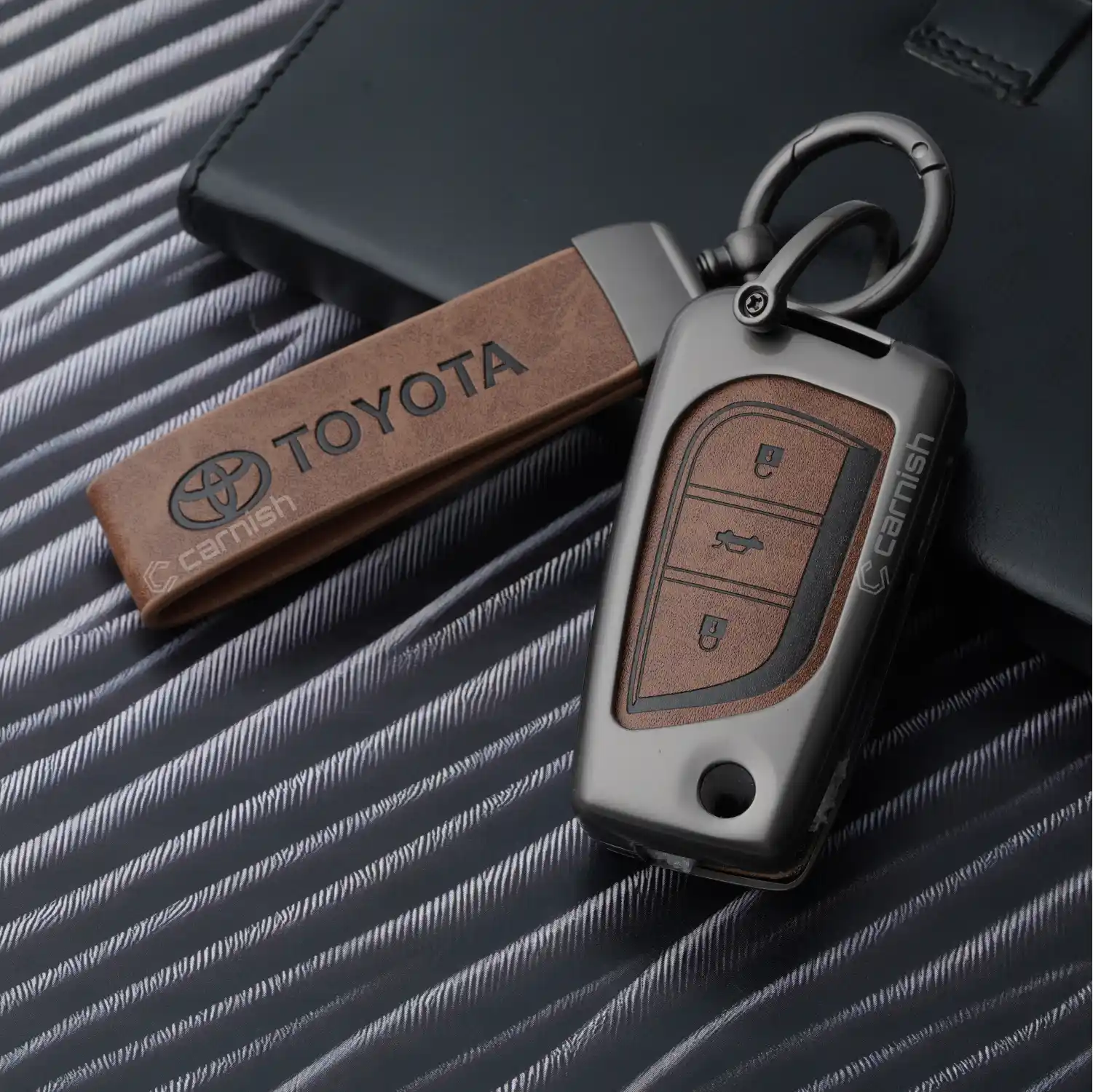 Metal Leather Brown Key Cover For Toyota: Innova Crysta, Corolla Altis 3 button flip key.
